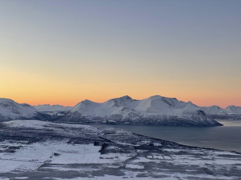 The mountains with the sunset behind it